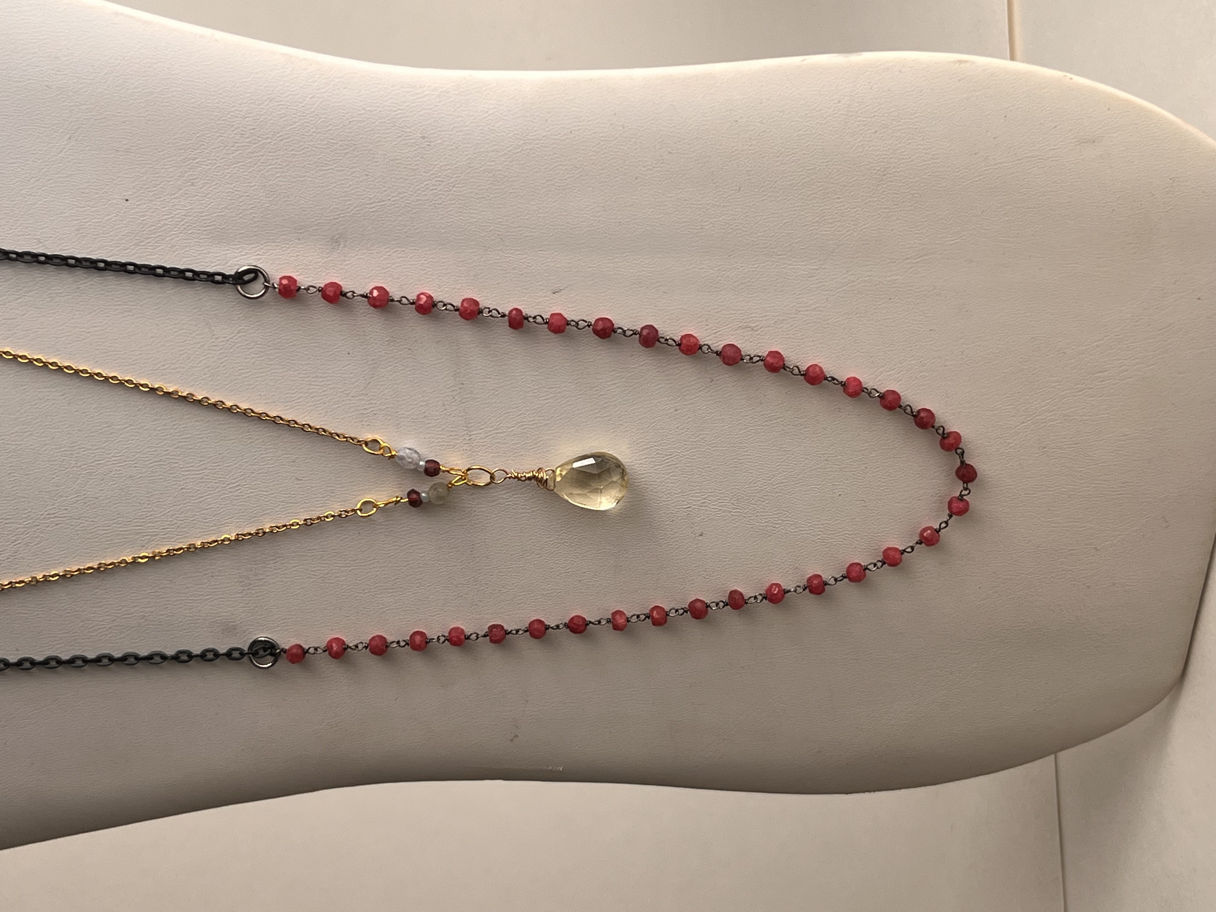 Ember Carrier — handmade sustainable luxury jewelry detail, responsible materials, angle 2